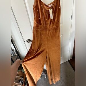 Francesca's Collections Orange Jumpsuit with Gold Stars